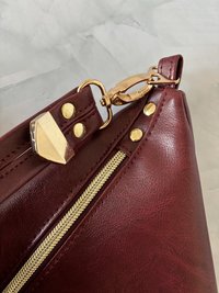 The Angler Slouchy Handbag - a rich, edgy, handbag with tassels + angled zipper giving it serious personality  - in a beautiful bordeaux faux leather
