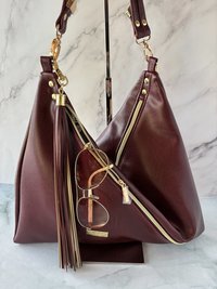 The Angler Slouchy Handbag - a rich, edgy, handbag with tassels + angled zipper giving it serious personality  - in a beautiful bordeaux faux leather