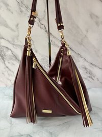The Angler Slouchy Handbag - a rich, edgy, handbag with tassels + angled zipper giving it serious personality  - in a beautiful bordeaux faux leather