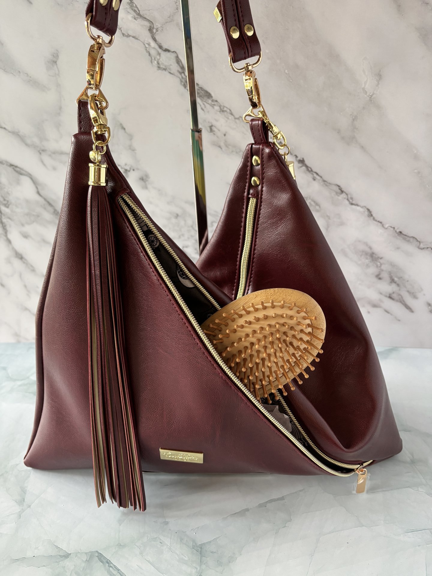 The Angler Slouchy Handbag - a rich, edgy, handbag with tassels + angled zipper giving it serious personality  - in a beautiful bordeaux faux leather