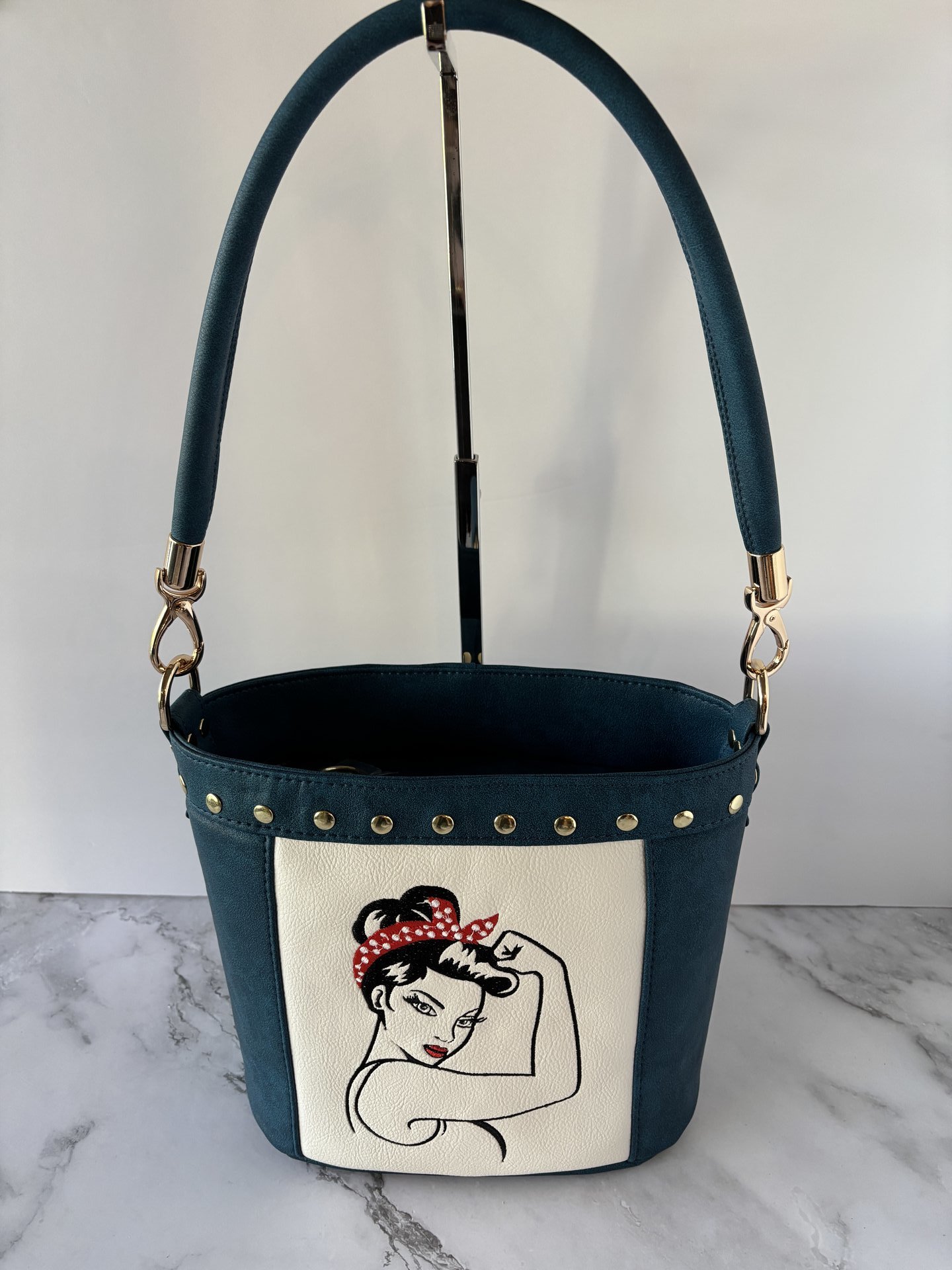 The Empowered Bucket Bag Set with Rosie vintage wartime icon inspired embroidery. Spacious, eye-catching, and designed for everyday style with attitude.