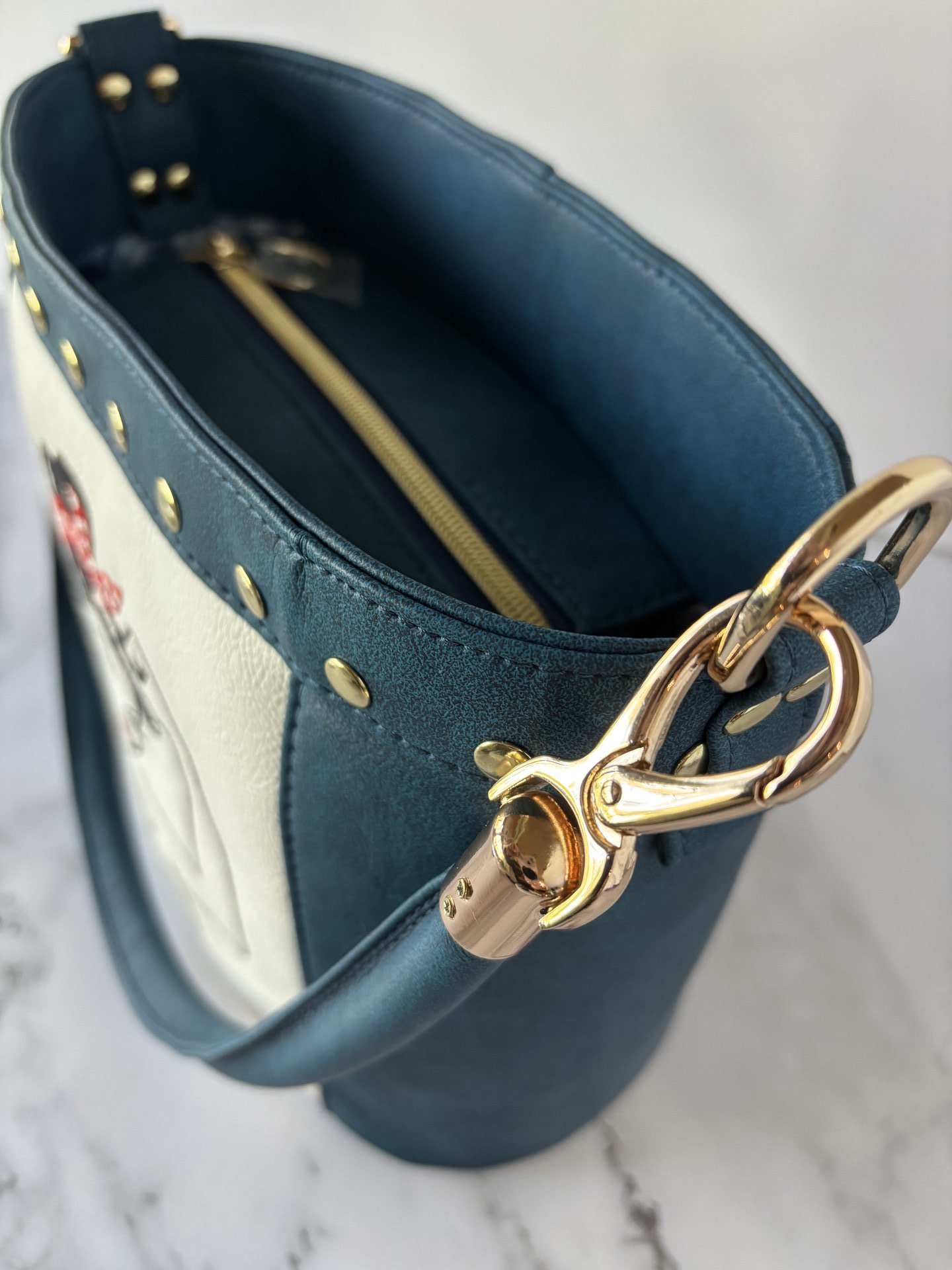 The Empowered Bucket Bag Set with Rosie vintage wartime icon inspired embroidery. Spacious, eye-catching, and designed for everyday style with attitude.