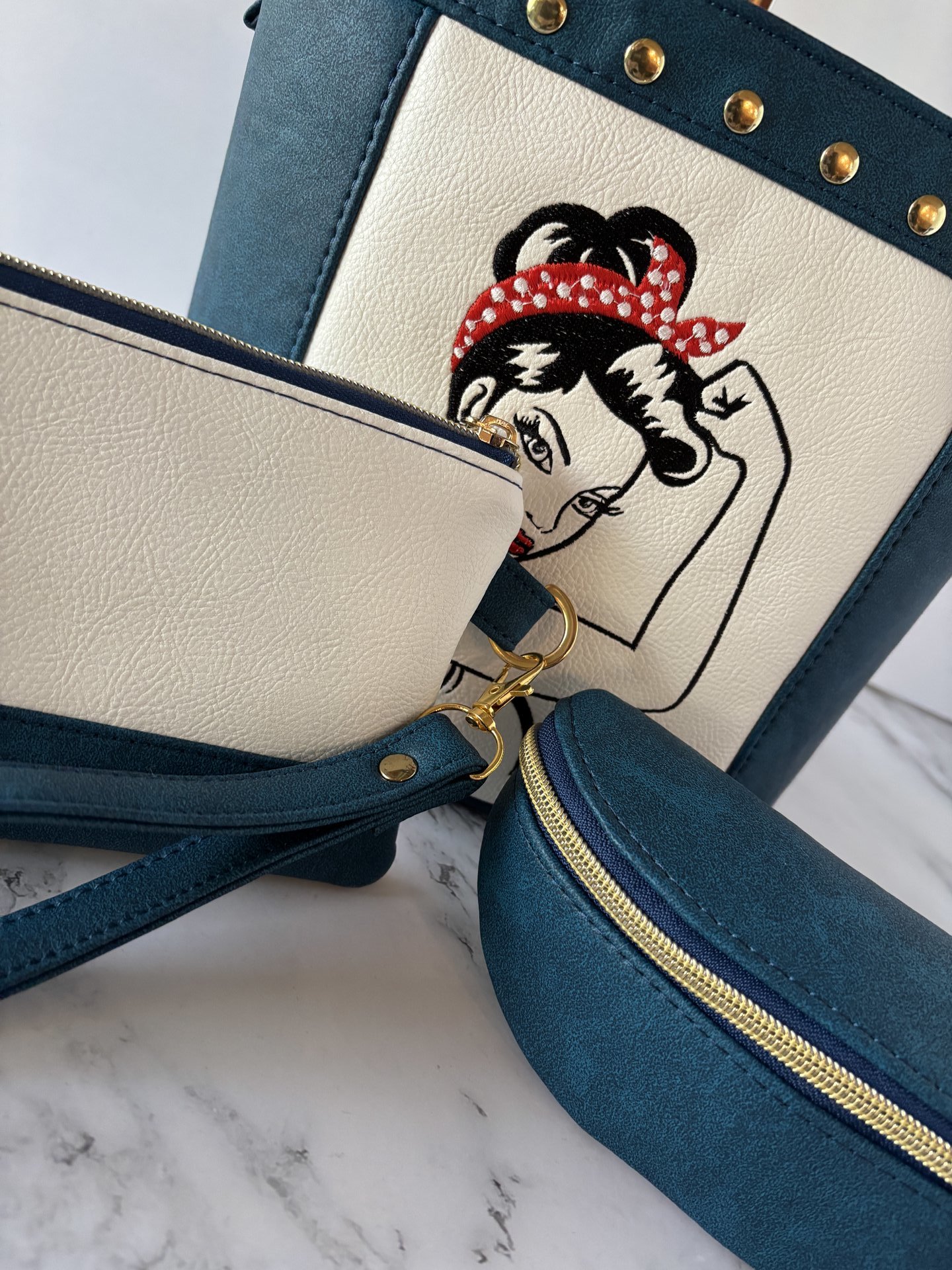 The Empowered Bucket Bag Set with Rosie vintage wartime icon inspired embroidery. Spacious, eye-catching, and designed for everyday style with attitude.